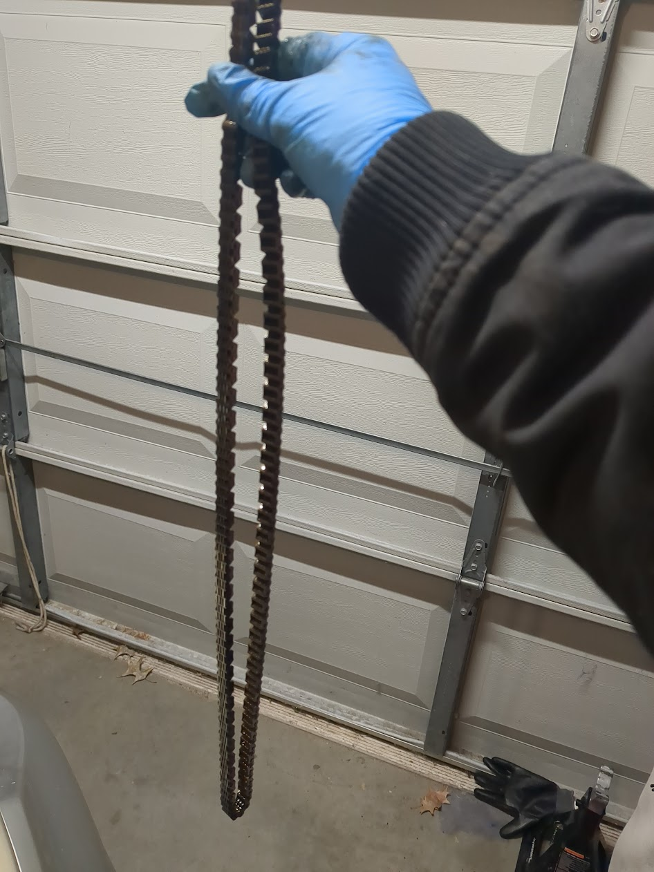 Old stretched timing chain held up for comparison